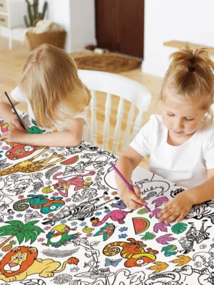 Children colouring a giant safari-themed table cloth activity sheet from Tiny Explorers Hub