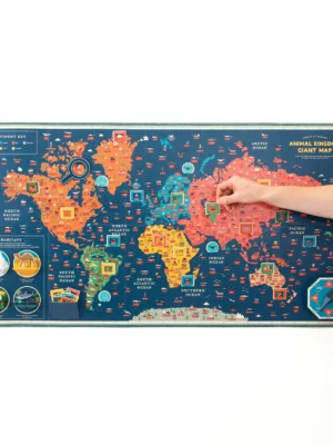 Children exploring a giant interactive animal kingdom world map activity kit from Tiny Explorers Hub